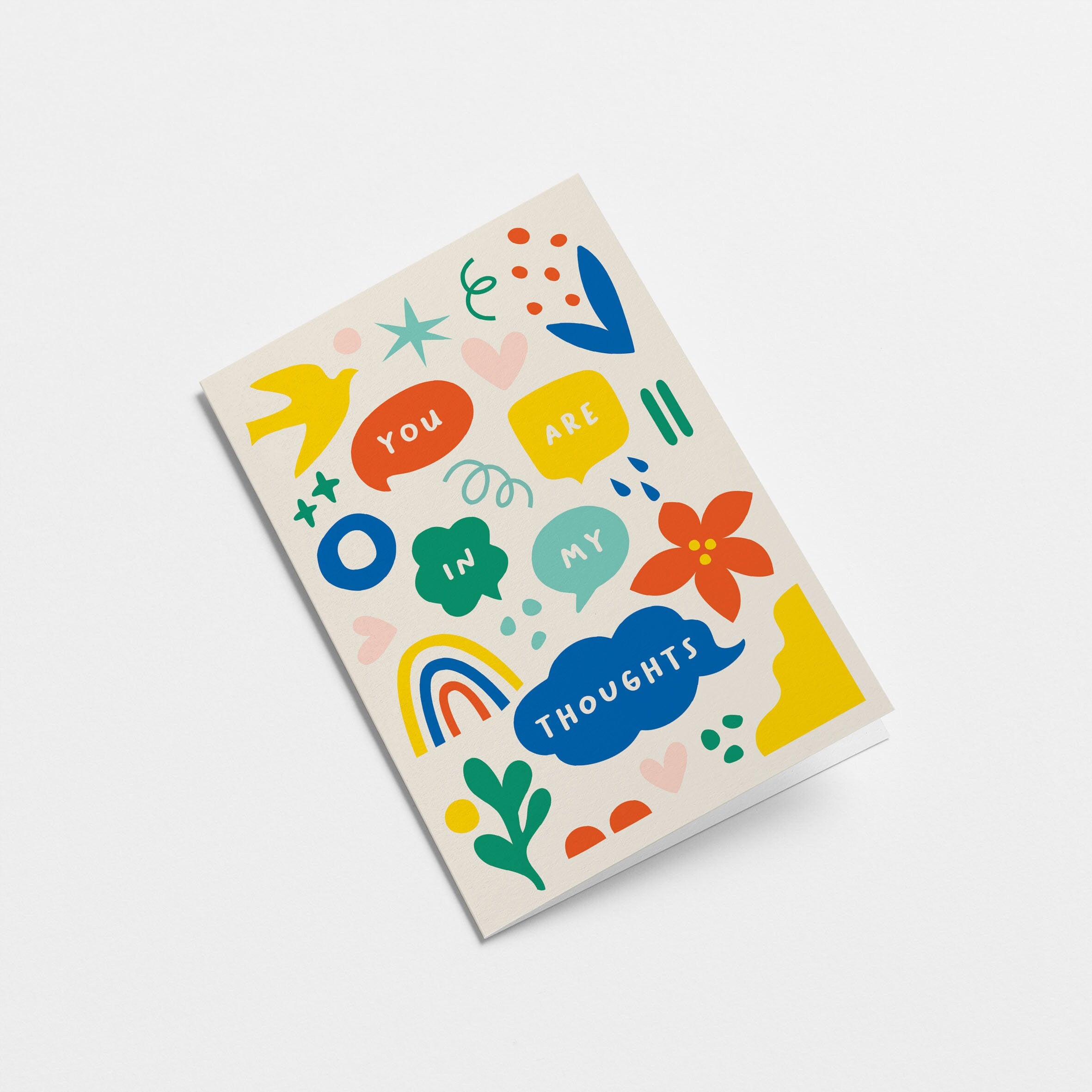 Greeting card with yellow, red, blue, green, pink figures and a text that says You are in my thoughts