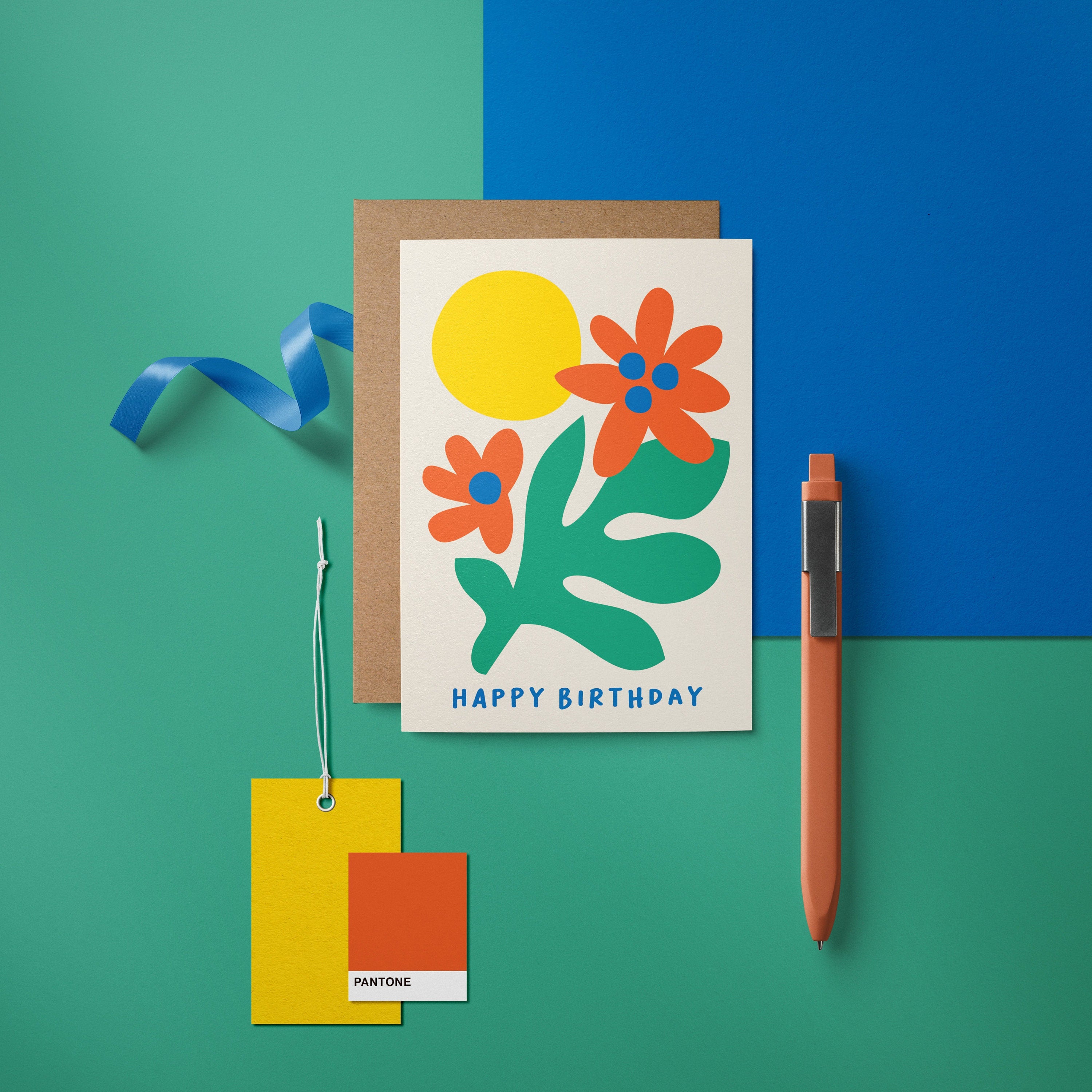 Birthday card with green plant, red and blue flowers and yellow sun with a text that says happy birthday