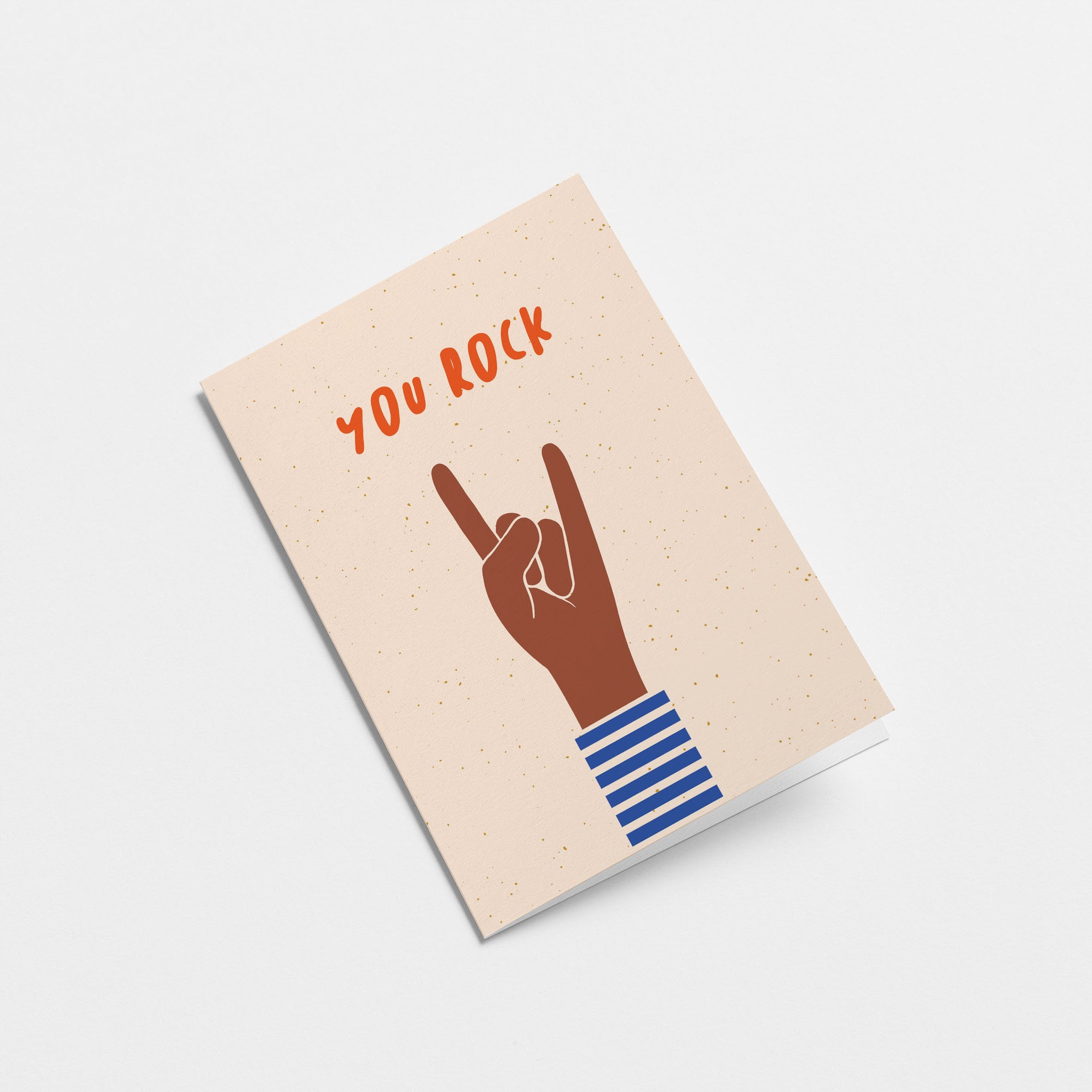 birthday card with a brown hand and a gesture of sign of the horns with a text that says you rock