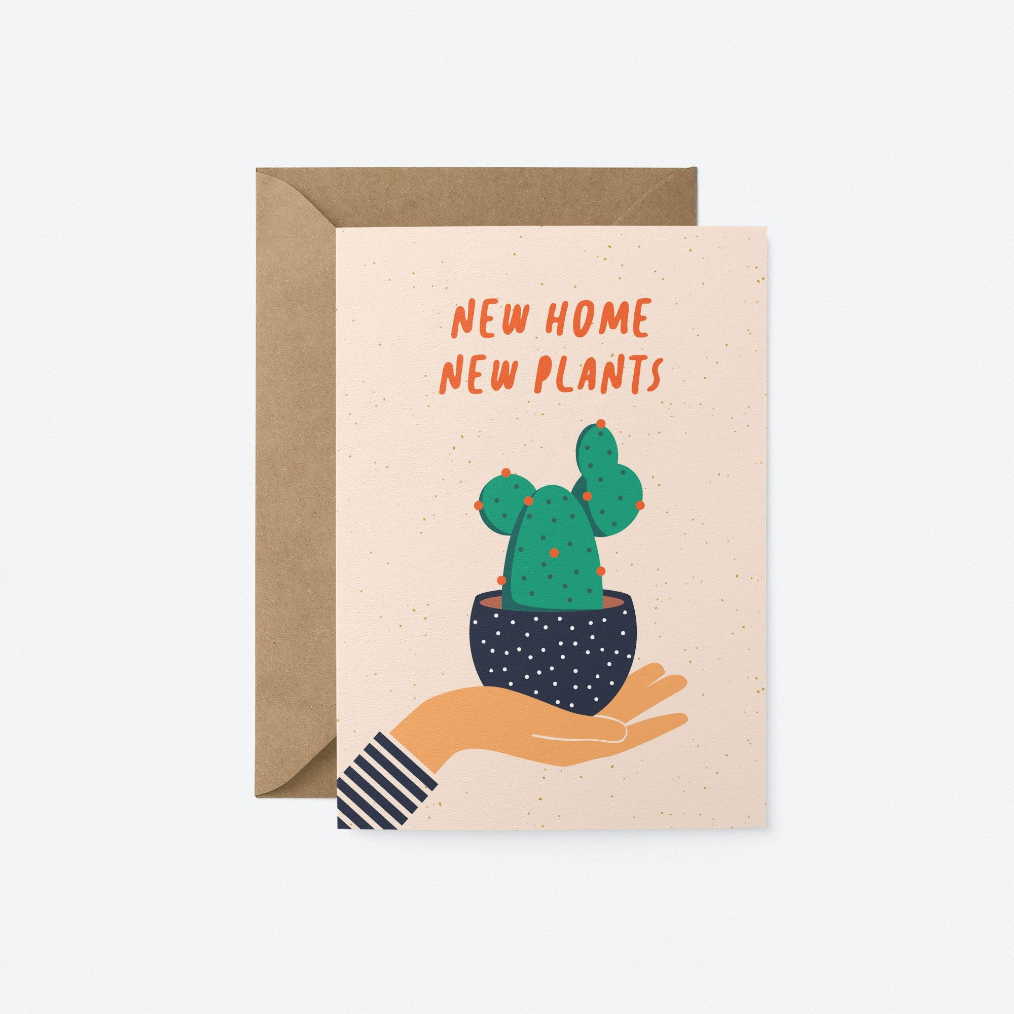 housewarming card with a hand holding a black flowerpot with a cactus in it and a text that says new home new plants