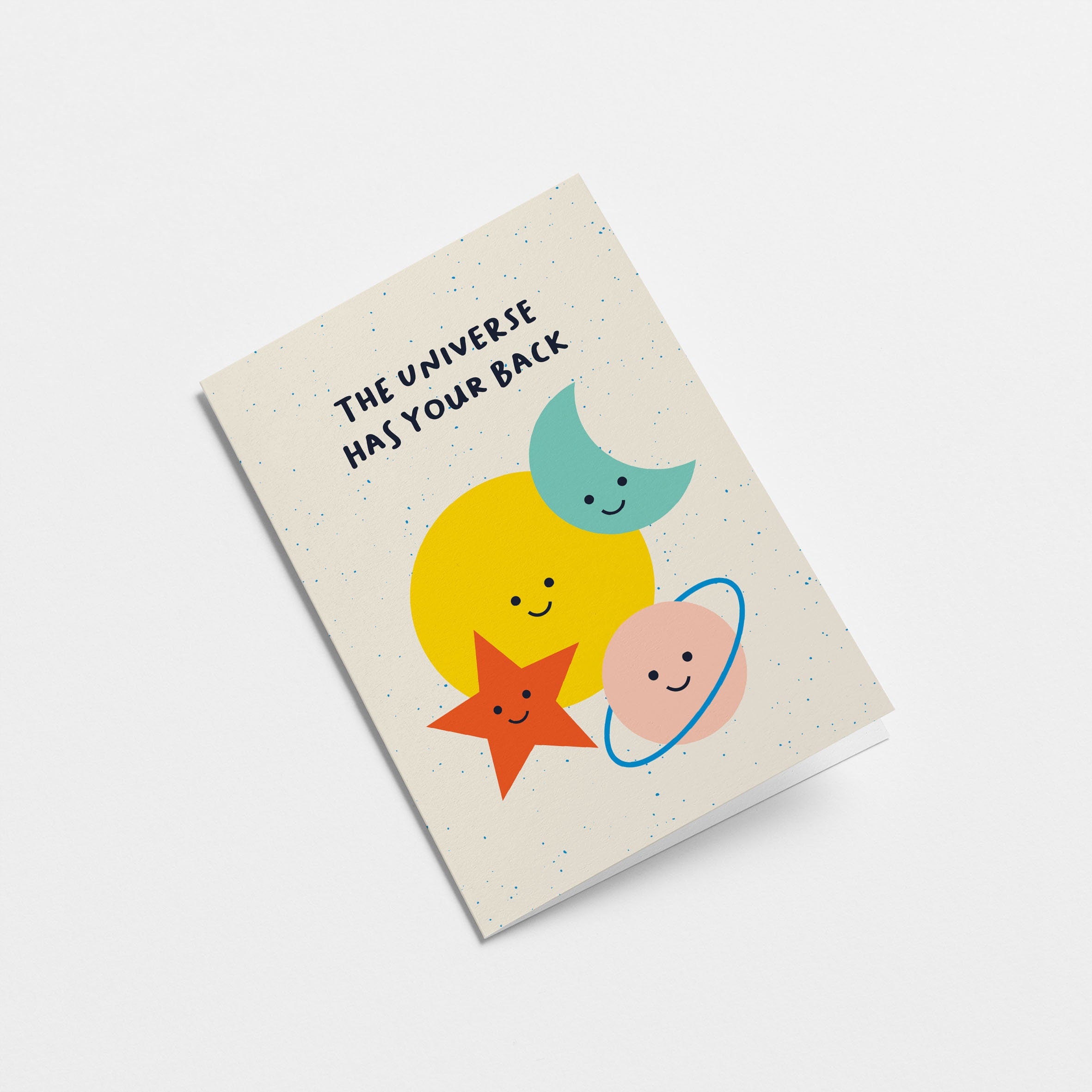 Everyday greeting card with a yellow sun, blue crescent moon, red star and pink planet and a text that says the universe has your back