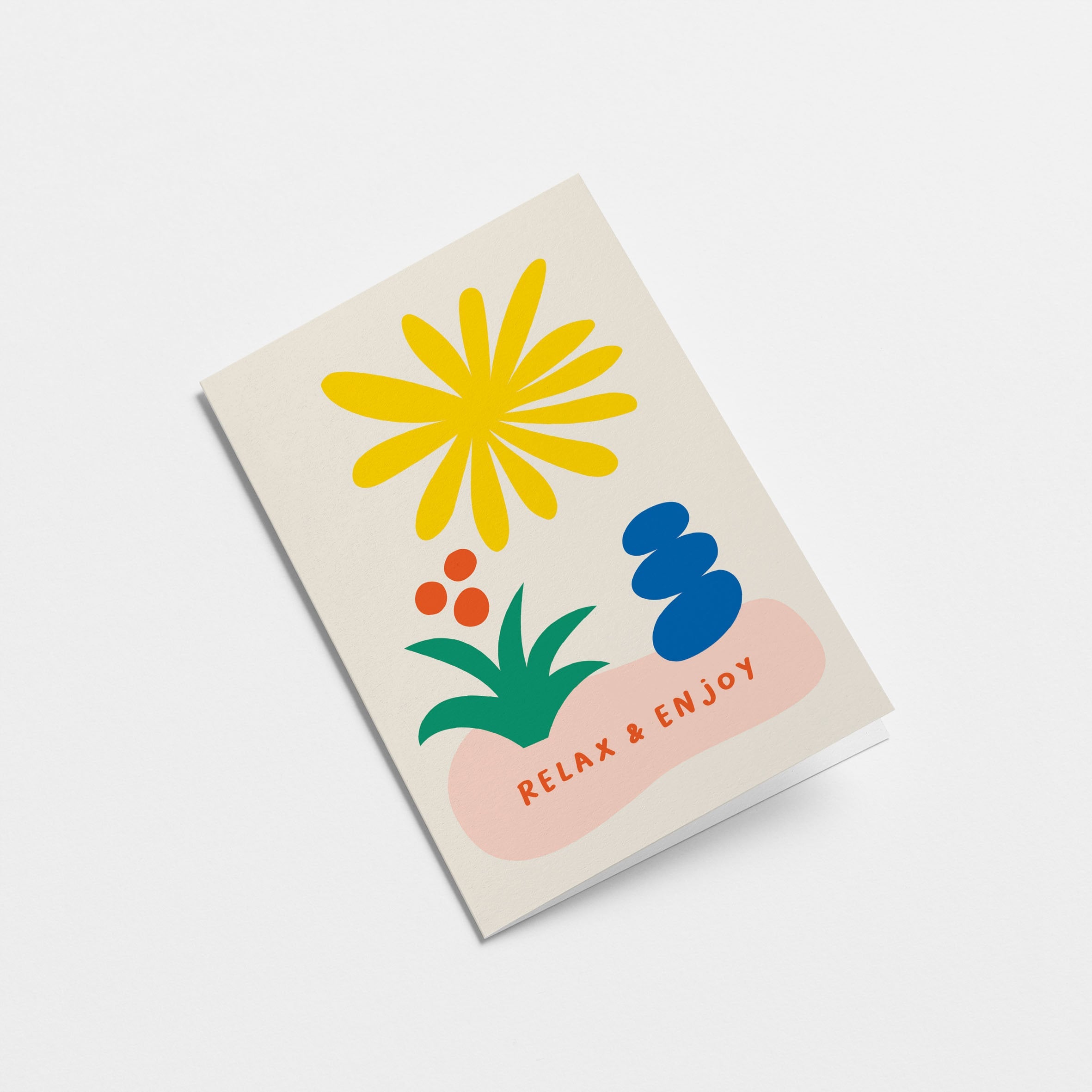 Friendship card with yellow sun figure, green and red flower, blue figure and a text that says Relax & Enjoy