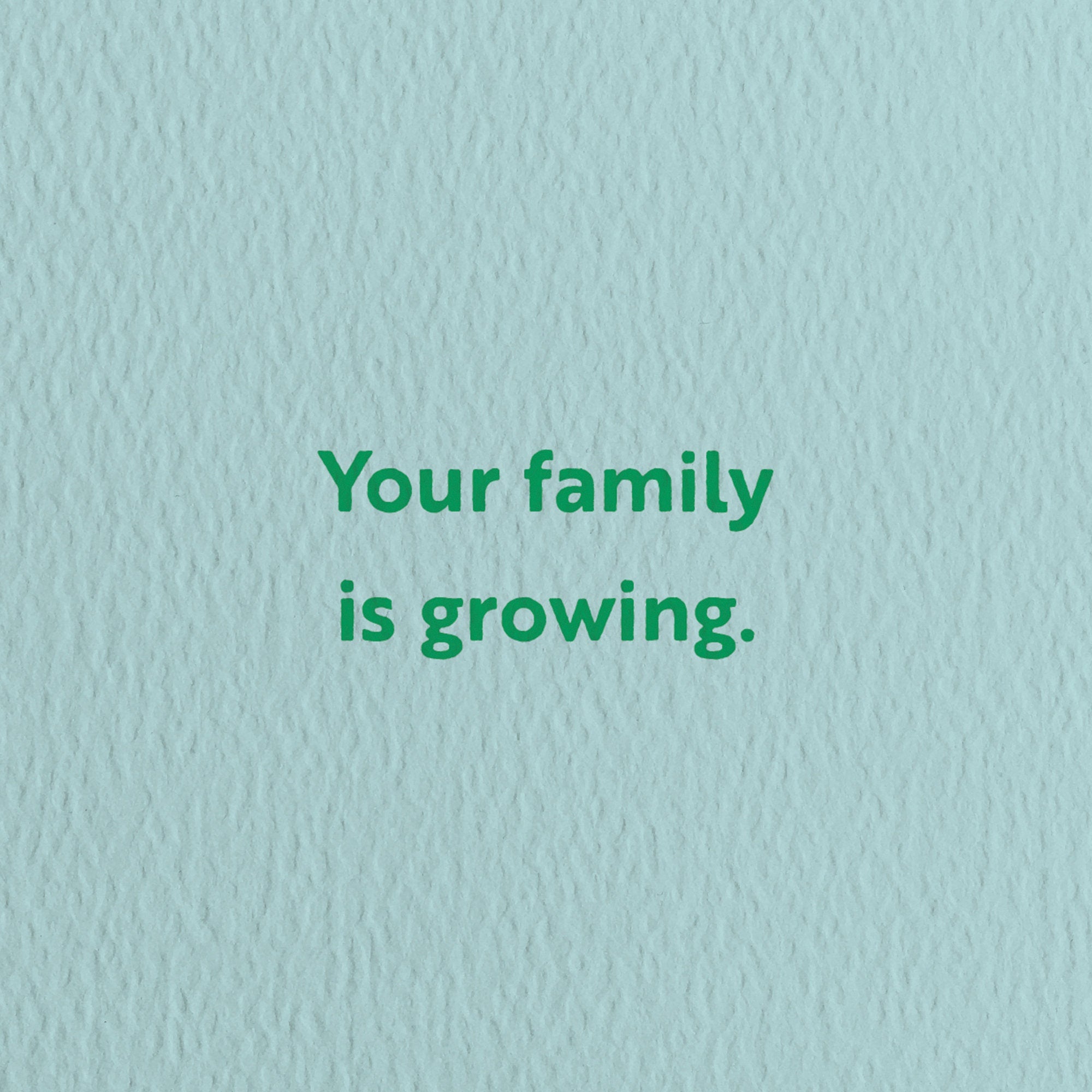 new baby card with a text that says your family is growing