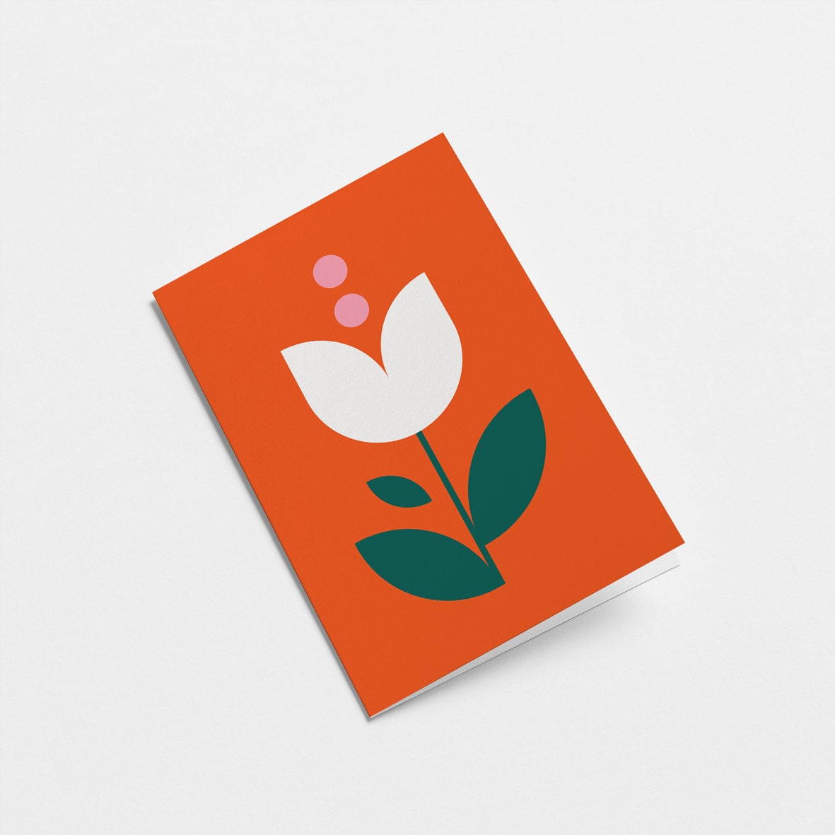 everyday greeting card with a white tulip and green leafs